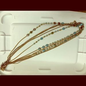 Long gold and teal necklaces
